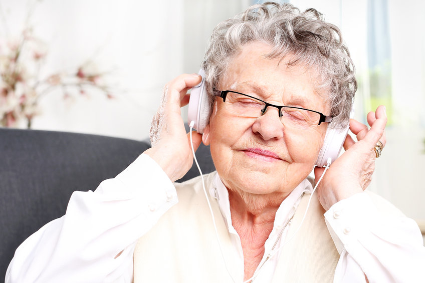 Older adult is listening to music.