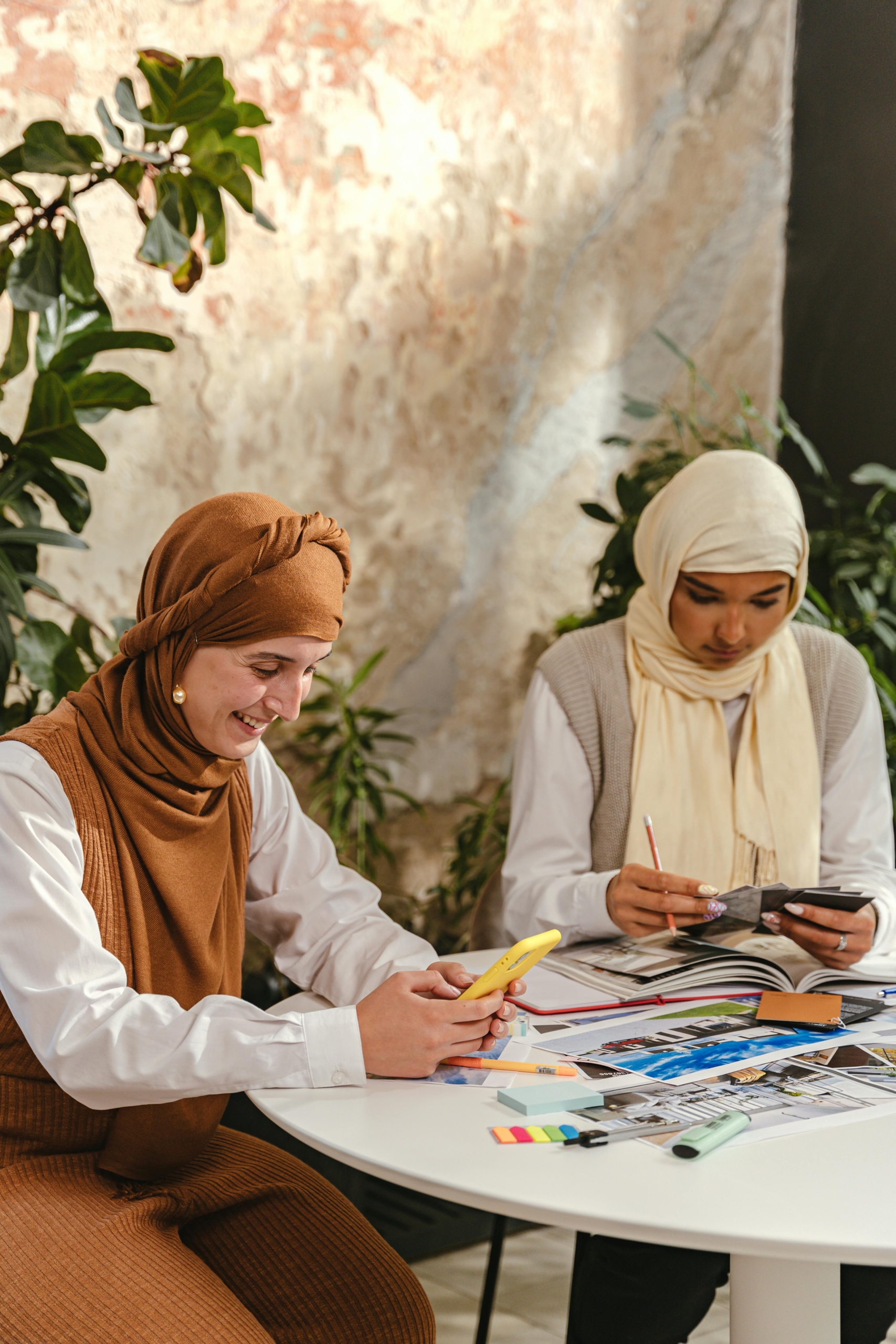 Two siblings planning a family celebration for older loved one