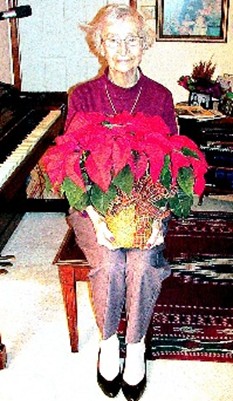 This Christmas photo was taken 10 years following my mother's diagnosis of Alzheimer's. That evening, we were energized by having sung many Christmas carols at the piano. I suggested we take her Christmas photo. Without saying a word, she picked up the poinsettia from the piano and sat down next to the piano ready to be photographed. This showed her quick response, understanding, and desire to get into the action. She liked being photographed.