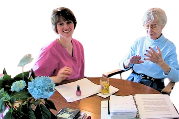 Miss Ethel is peacefully inspecting the pretty results of a manicure while also benefitting from therapeutic touch known to be healing in dementia care. 