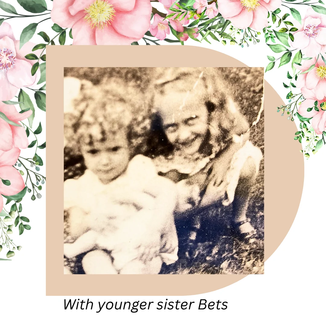 Photo of 2 sisters surrounded by flowers